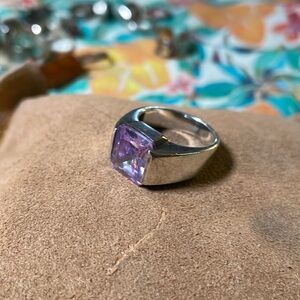 Sterling silver and amethyst colored stone. Size 8